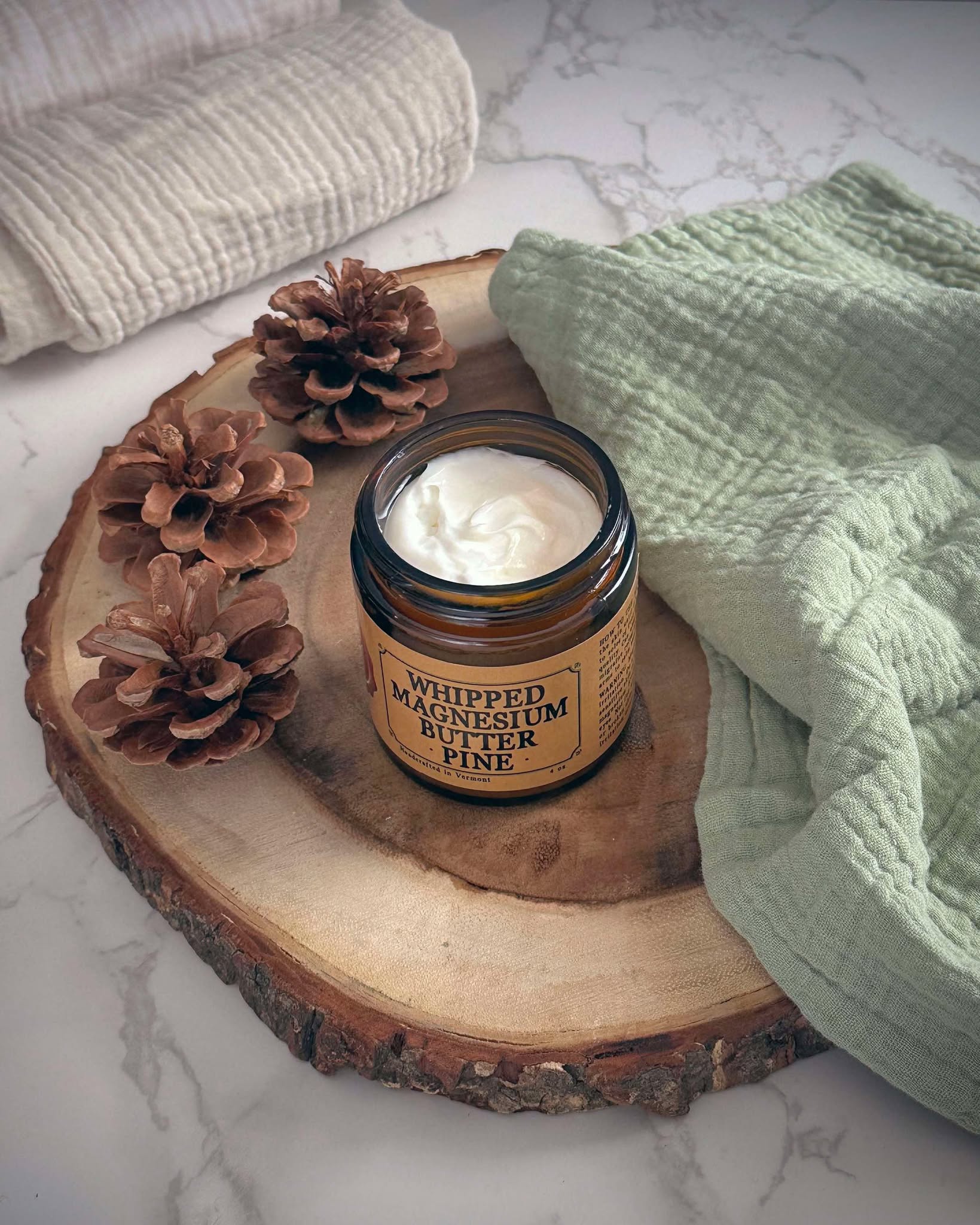 Open jar of Whipped Magnesium Butter in Pine Scent