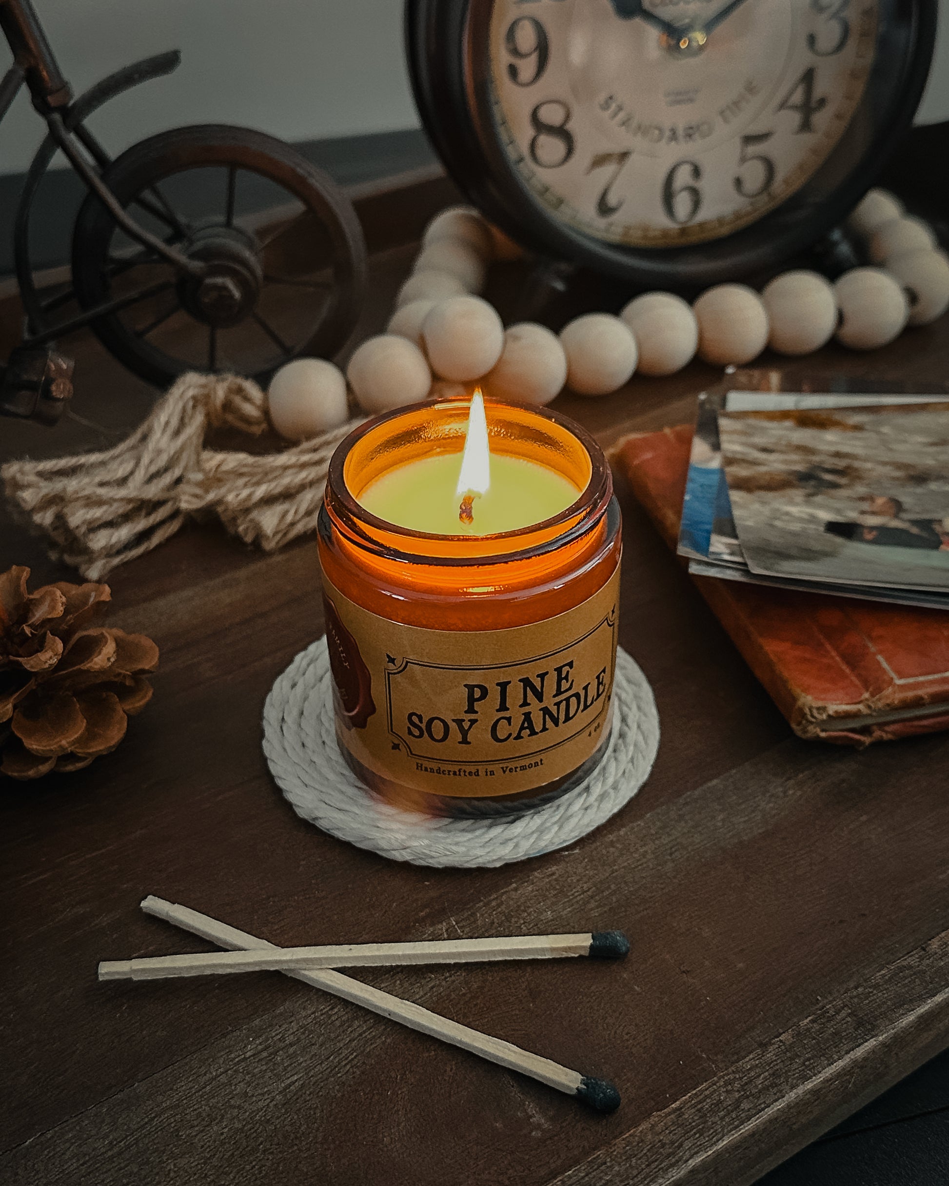 Lit Pine Scented Soy Candle in an Amber Jar