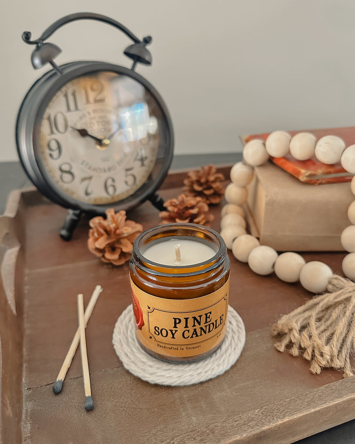 Unlit pine soy candle in an amber jar