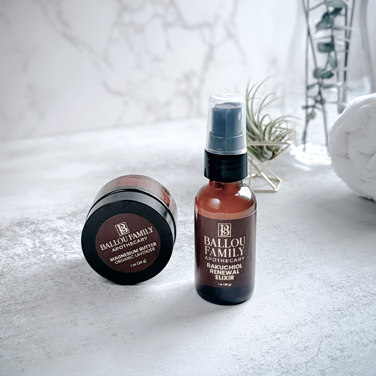 Two Ballou Family products on a light surface with a blurred background