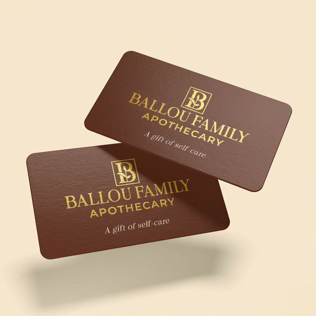 Two brown gift cards with 'Ballou Family Apothecary' logo and text on a beige background