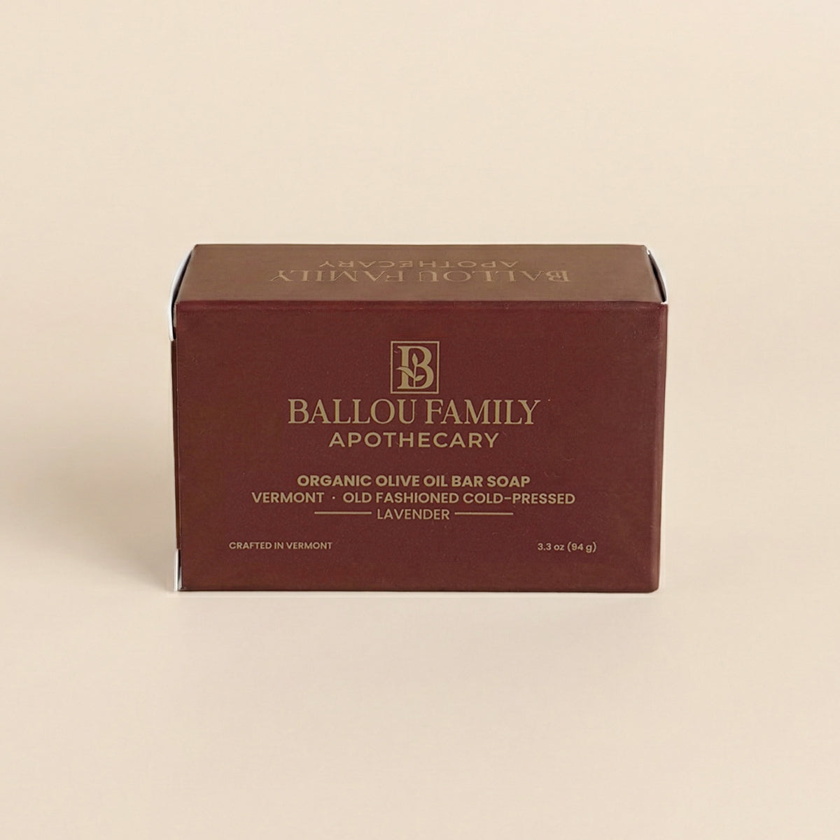 Ballou Family Apothecary soap bar packaging on a beige background