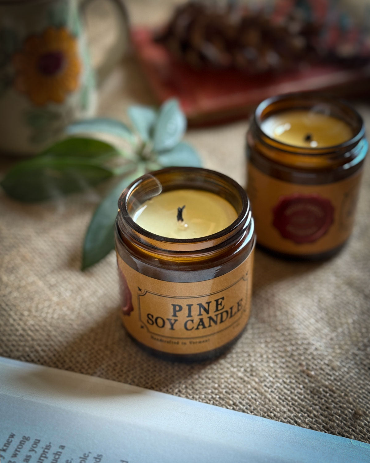 Pine soy candle in an amber jar