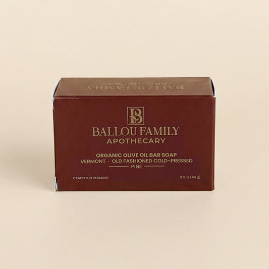 Ballou Family Apothecary organic olive oil bar soap packaging on a beige background