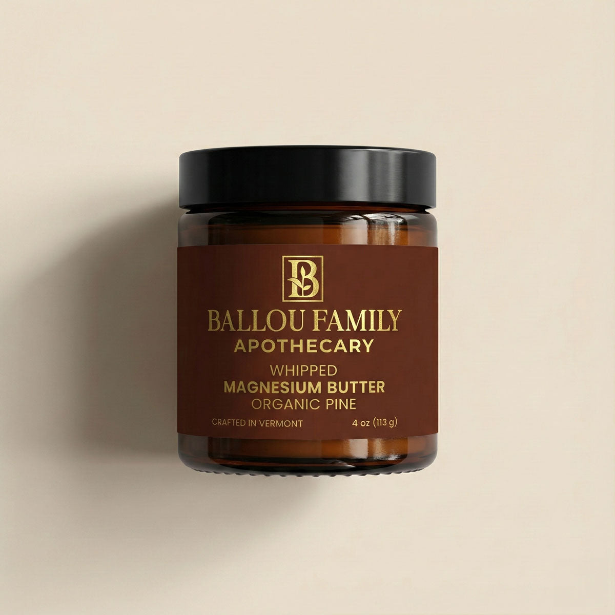 Jar of Ballou Family Apothecary whipped magnesium butter on a beige background