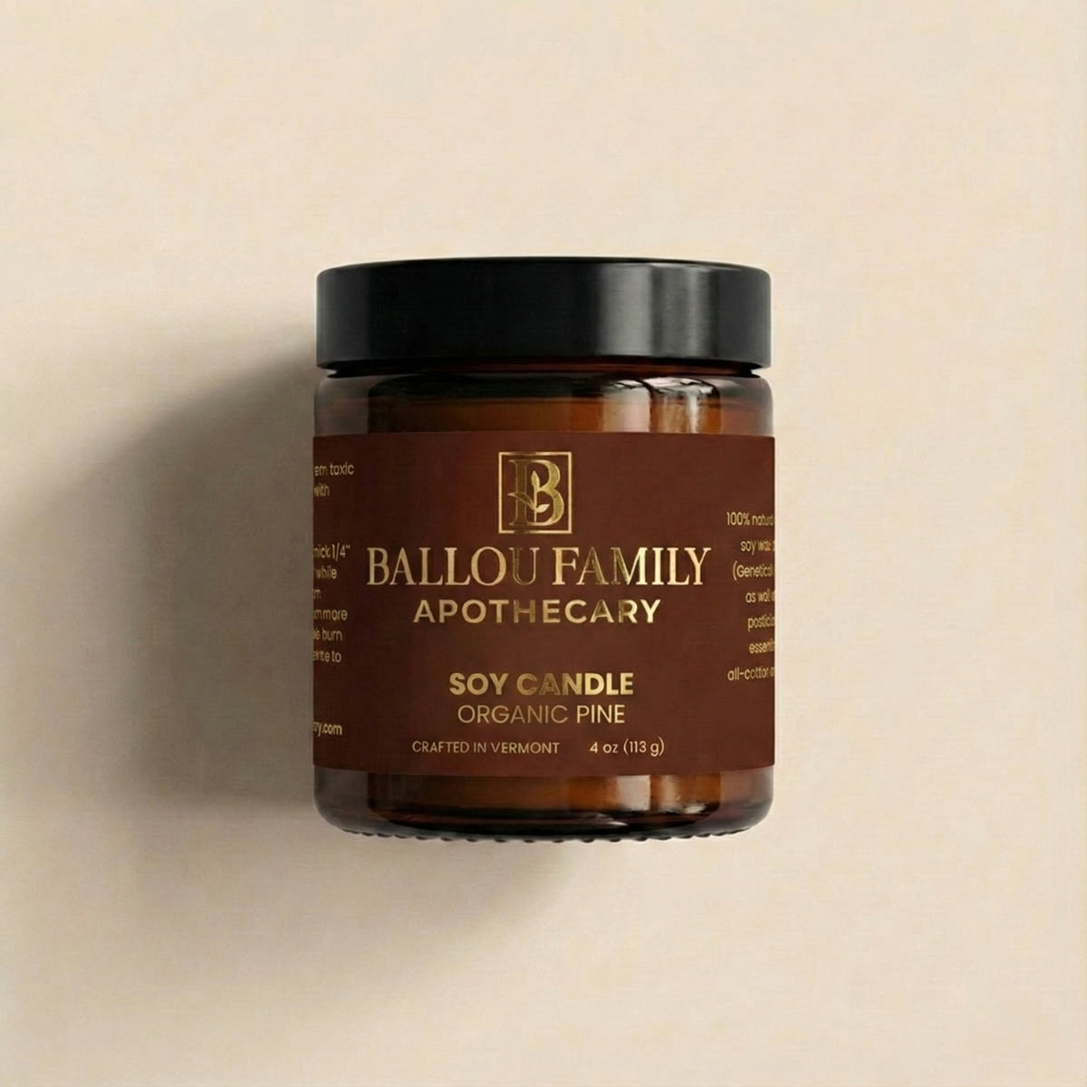 Jar of Ballou Family Apothecary soy candle on a beige background