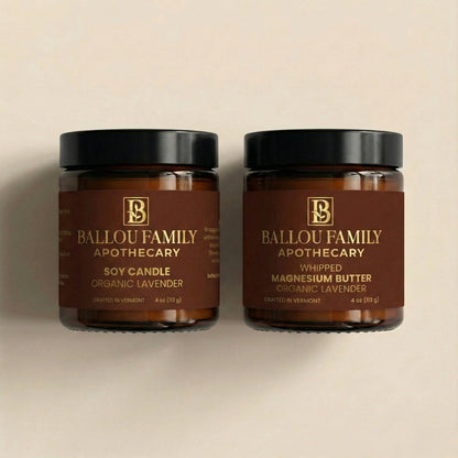 Two jars of Ballou Family Apothecary products on a beige background