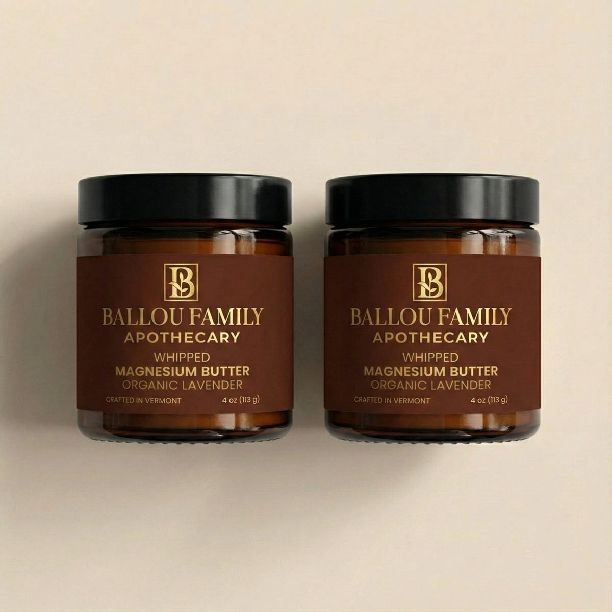 Two jars of Ballou Family Apothecary whipped magnesium butter on a beige background
