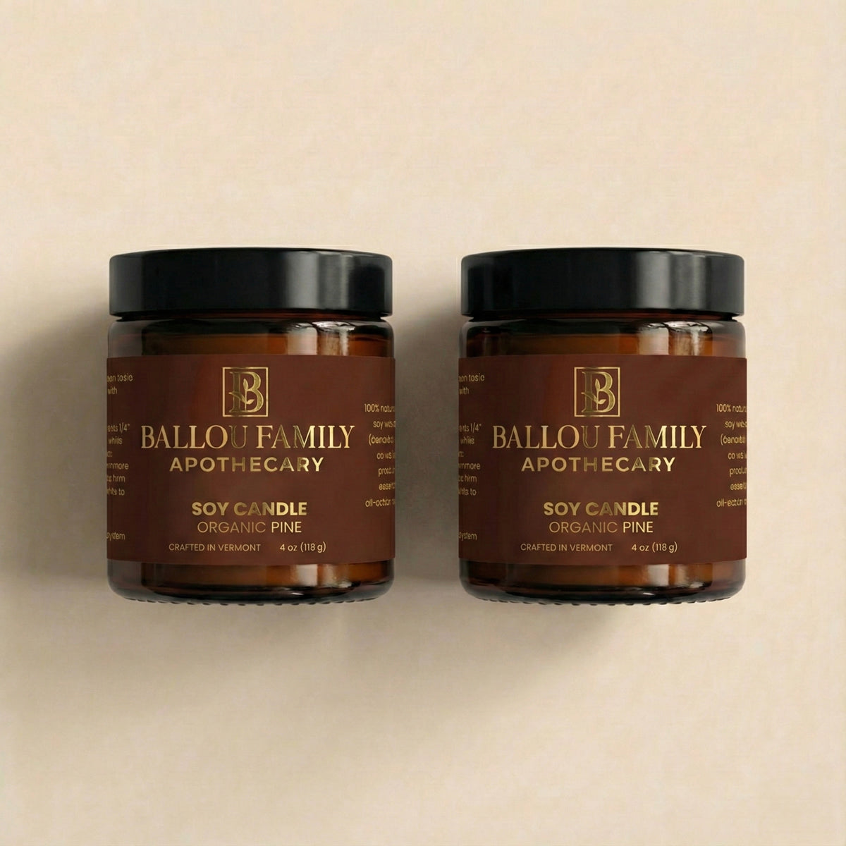Two Ballou Family Apothecary soy candles on a beige background