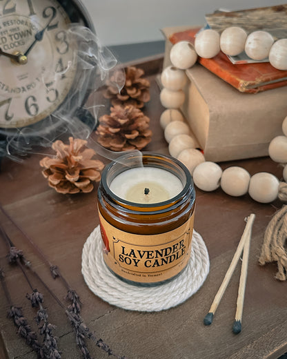 Lavender Soy Candle that was just blown out and has smoke 