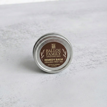 1  oz Remedy Balm tin with 'Ballou Family Apothecary' label on a light gray background